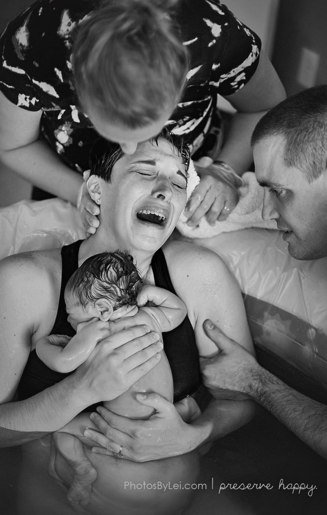 baby-just-born-her-mothers-arms-water
